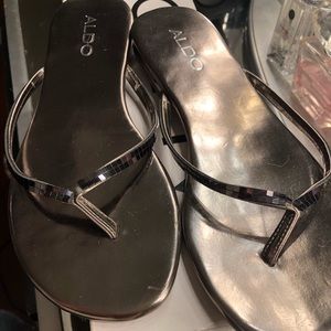 Pewter colored flip-flops